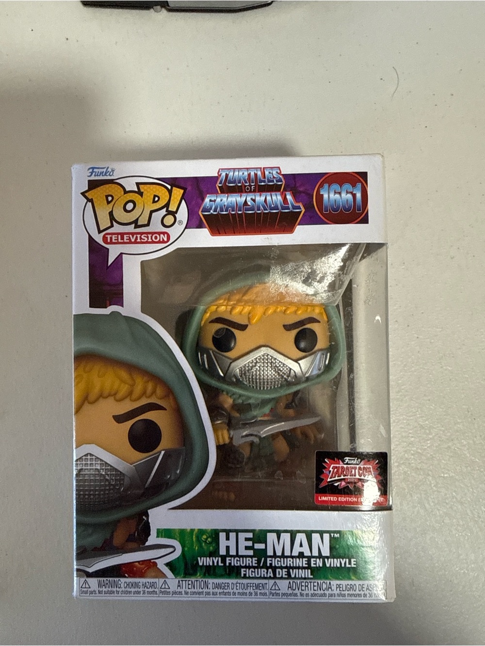 Funko Pop! He-Man in Green Hood with Silver Mask and Yellow Hair